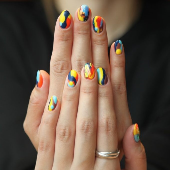 woman's nails with manicure