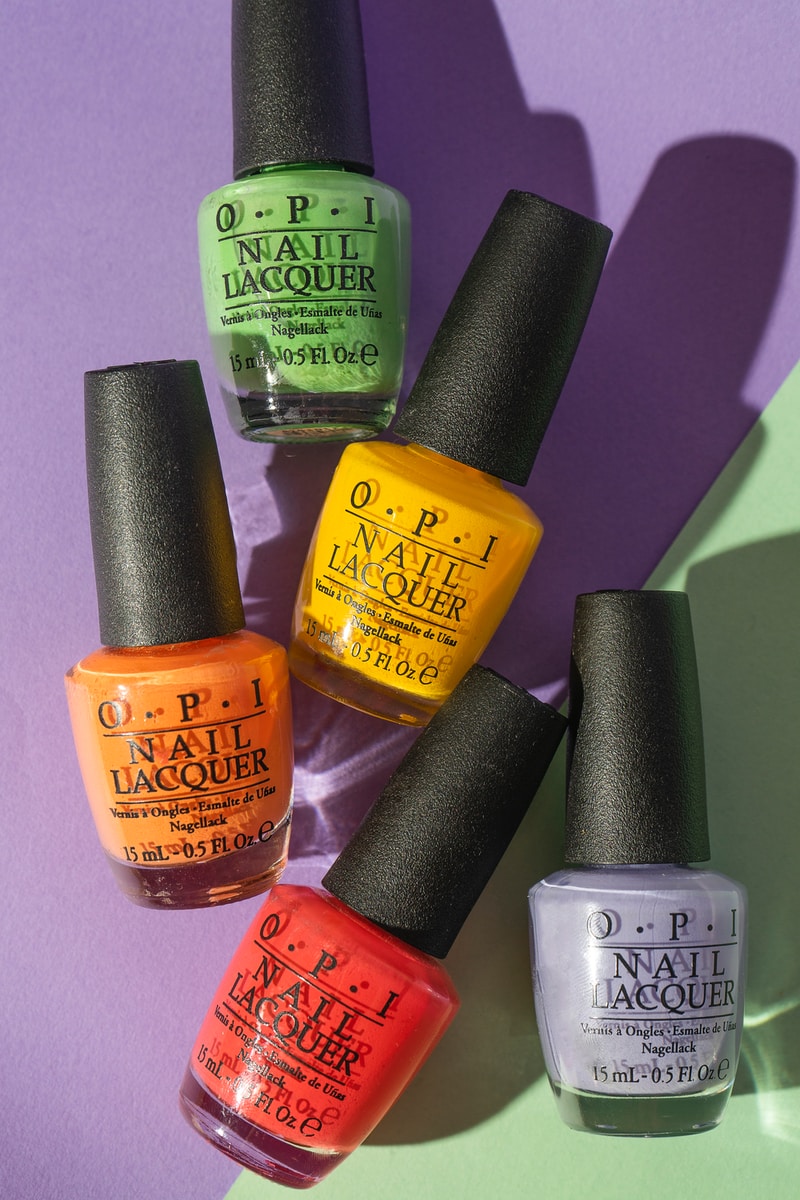 Photo by Cut Collective six nail polish bottles on purple surface